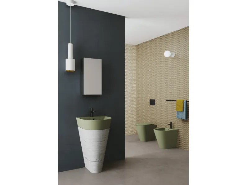 Mobile Bagno a terra finitura cemento dalla forma conica con lavabo in ceramica verde natura Forma 01 di Azzurra Ceramica