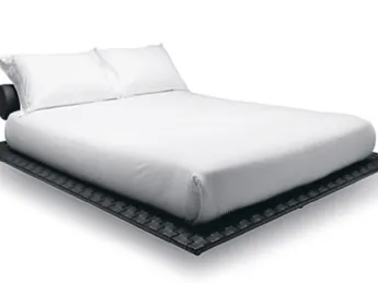 Il letto Heron di Tumidei unisce eleganza e comfort in un design essenziale.