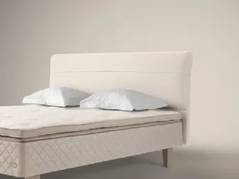 Letto con testiera imbottita stile Duxiana