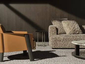 Poltrona Armand di Molteni & C: pelle e tessuto in perfetto equilibrio.