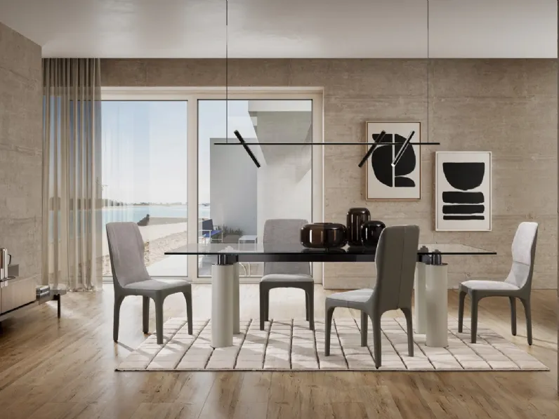 Tavolo Anima con piano in cristallo e gambe in metallo rivestite in pelle di Albani