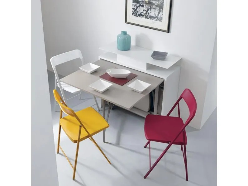 Consolle allungabile in acciaio e laminato che contiene le sedie al suo interno Archimede di Pezzani