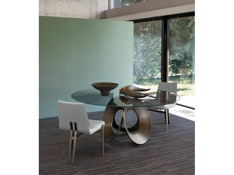 Tavolo rotondo con top in vetro e base scultorea in metallo Oracle di Arketipo