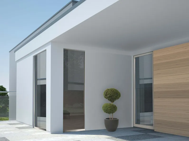 Finestra ad anta ascorrevole caratterizzata da profili minimali in legno di rovere con carter esterno in alluminio Hidden Wide Glass di De Carlo