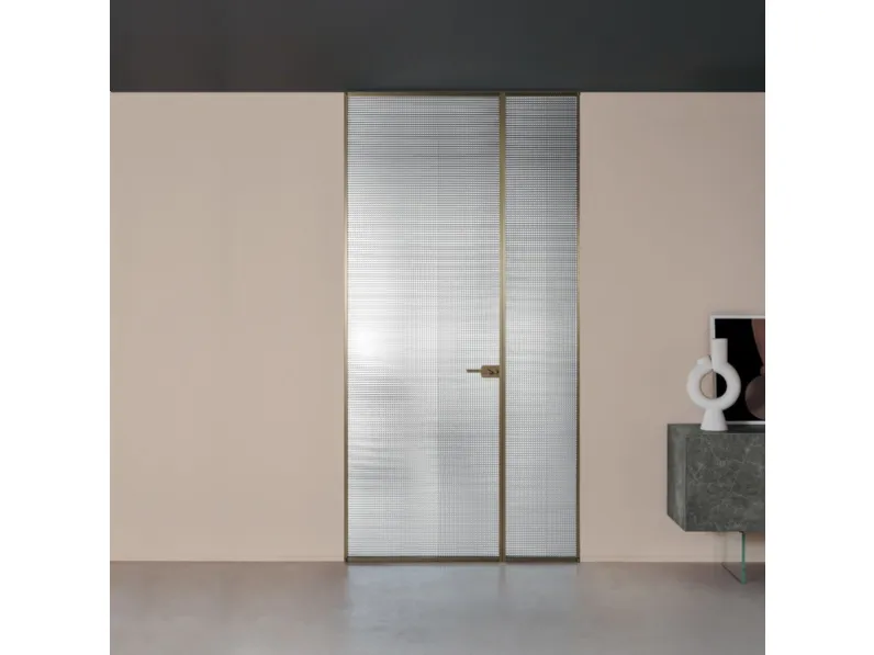Porta per interni a filo muro Sherazade Double Swing in vetro con telaio in alluminio Plain di Glas Italia