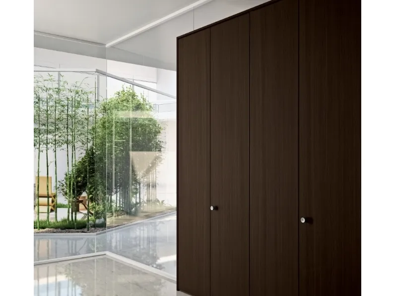 Pareti attrezzate divisorie Habitat 50 con armadiature in melaminico e pareti in vetro di Della Rovere