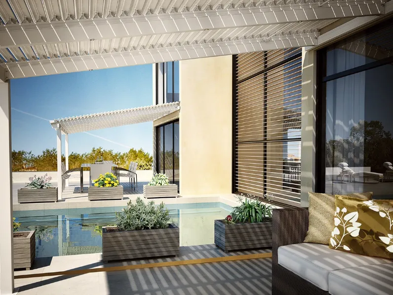 Pergola bioclimatica inclinata a lame orientabili, in grado di proteggere sia dal sole che dalla pioggia, consente comfort termico e luminoso Eclissi Addossata di Dirello