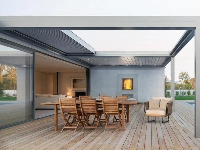 Pergola bioclimatica addossata con lame impacchettabili Velvet di Gibus